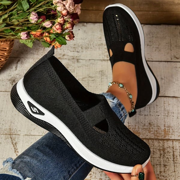 Pair of Soleil lightweight slip-on shoes shown from the back highlighting heel and sole construction