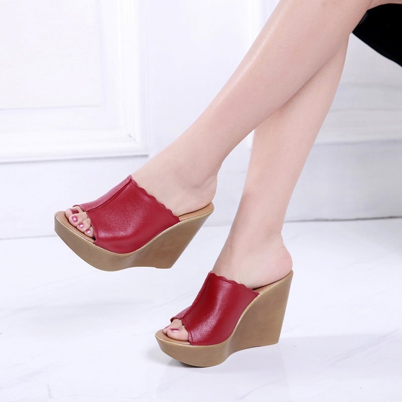 Pair of Soleil women's wedge sandals in brown arranged side by side on a neutral background