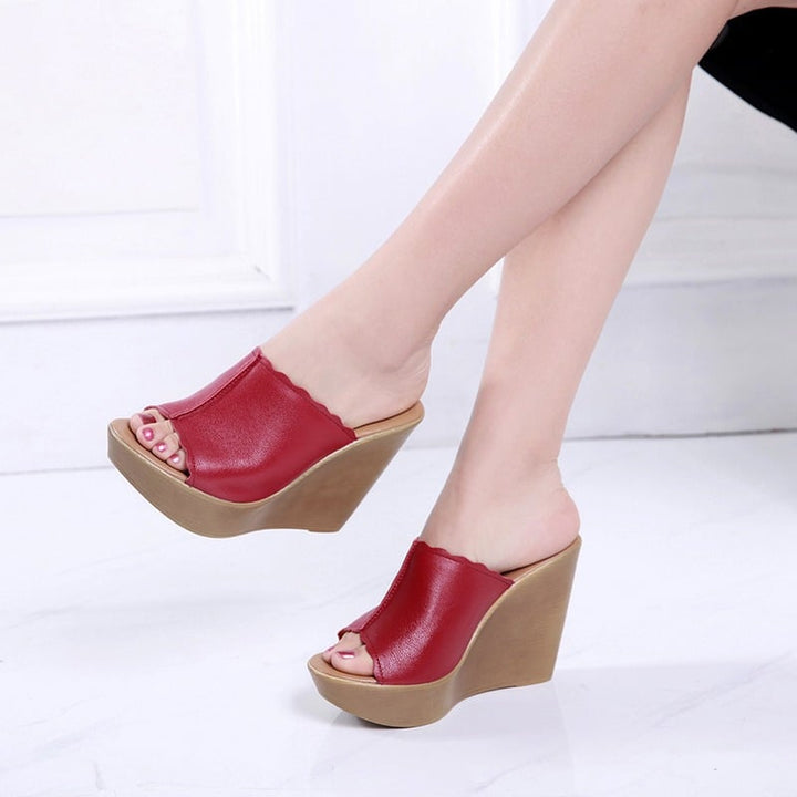 Pair of Soleil women's wedge sandals in brown arranged side by side on a neutral background