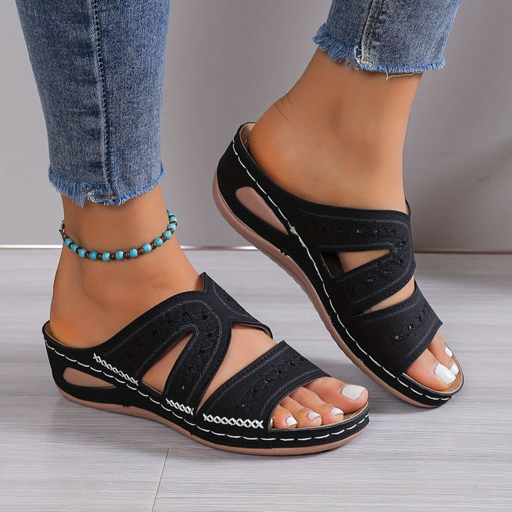 Side profile of women's orthopedic sandals showing extra-wide heel and deep footbed support