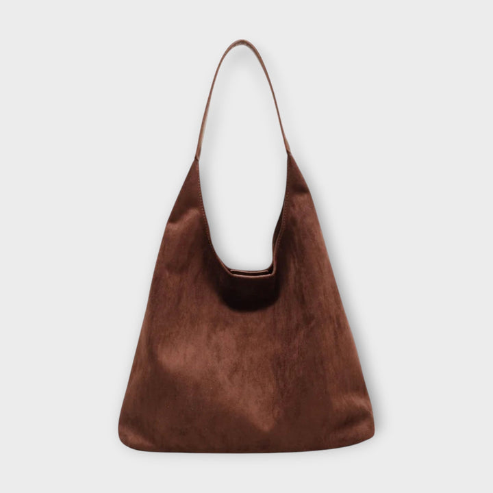 Soline minimalist shoulder bag in neutral color with simple shoulder strap, shown against clean background
