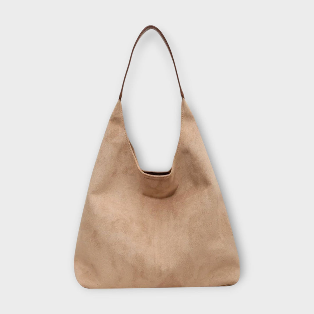 Close-up of Soline shoulder bag showing soft structured silhouette and smooth exterior finish
