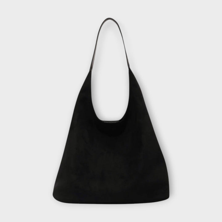 Soline shoulder bag styled in an everyday casual flat-lay with accessories