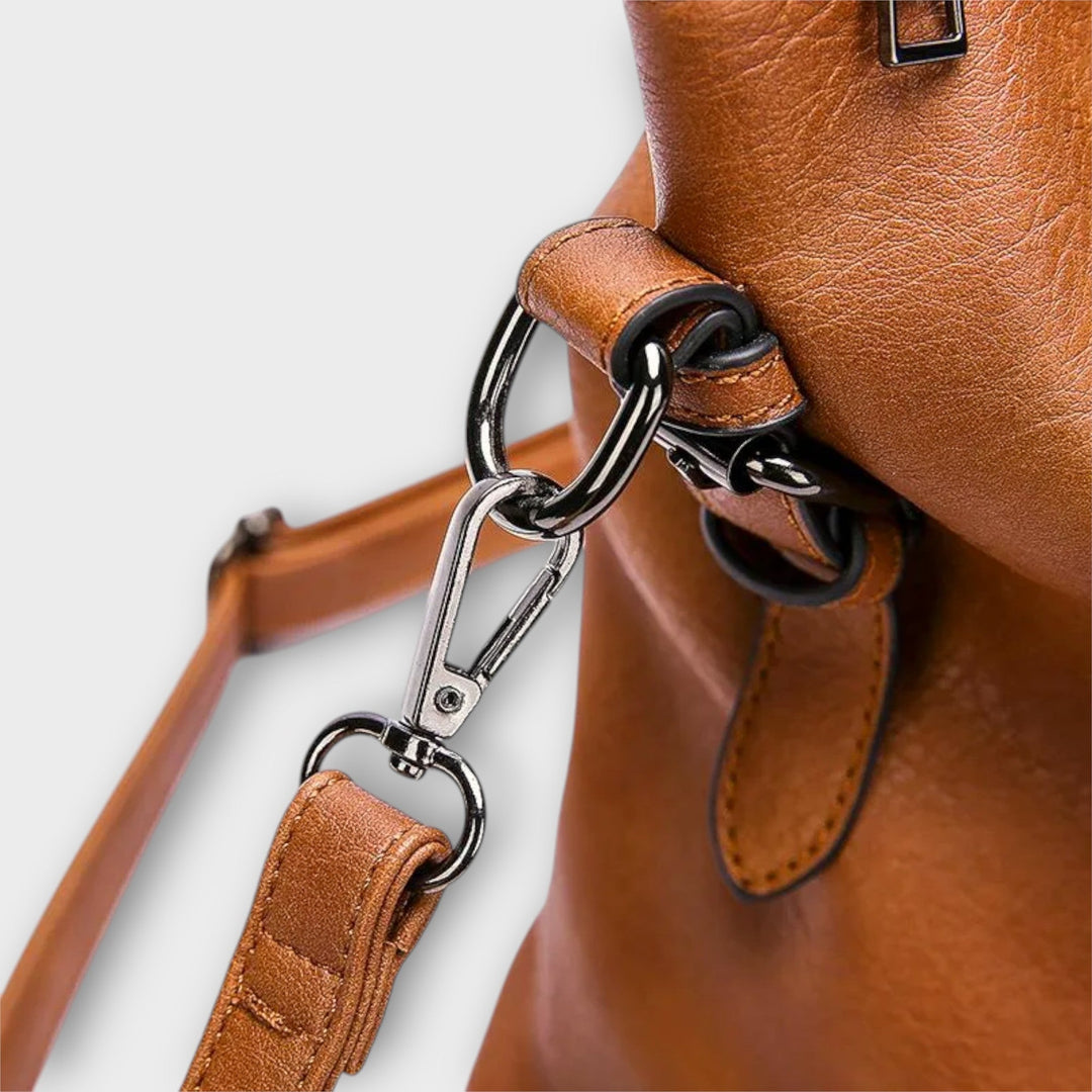 Close-up of Solveig handbag hardware and handle detail in black