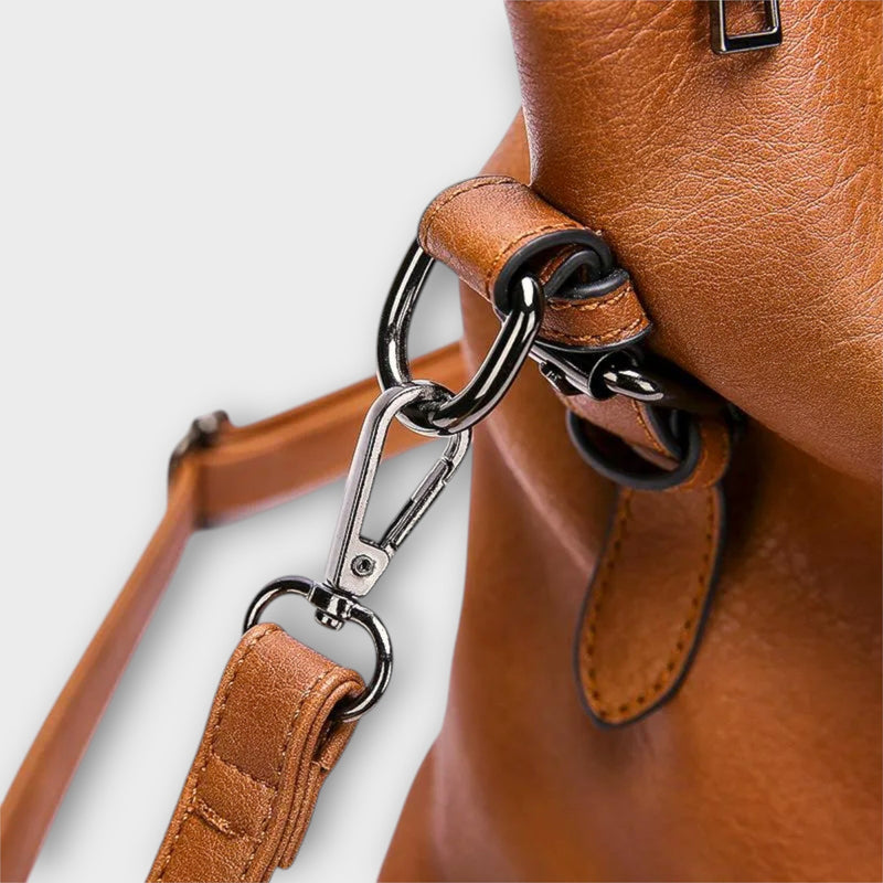 Close-up of Solveig handbag hardware and handle detail in black