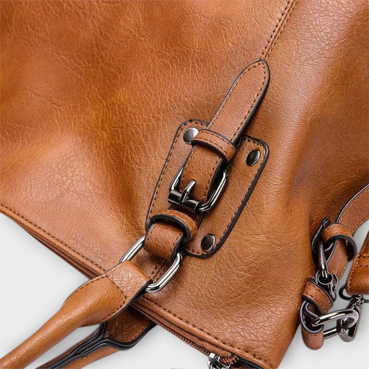 Solveig classic handbag in yellow shown from the front against a clean background