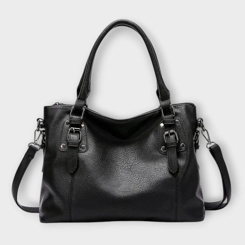 Side profile view of the Solveig structured handbag showing its spacious silhouette