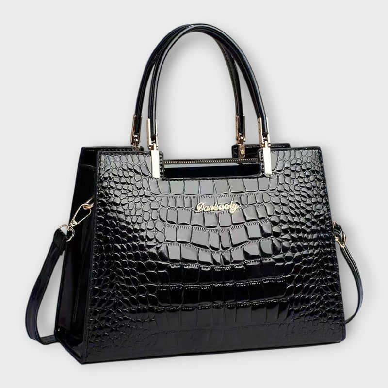 Solveig exclusive handbag in black with structured silhouette and shoulder strap on a clean background