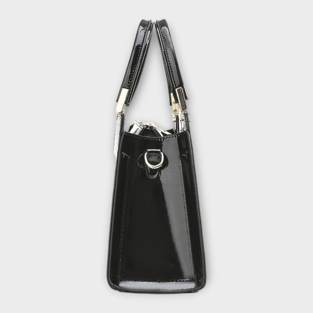 Solveig handbag in brown colorway displayed at a slight angle to show depth and shape