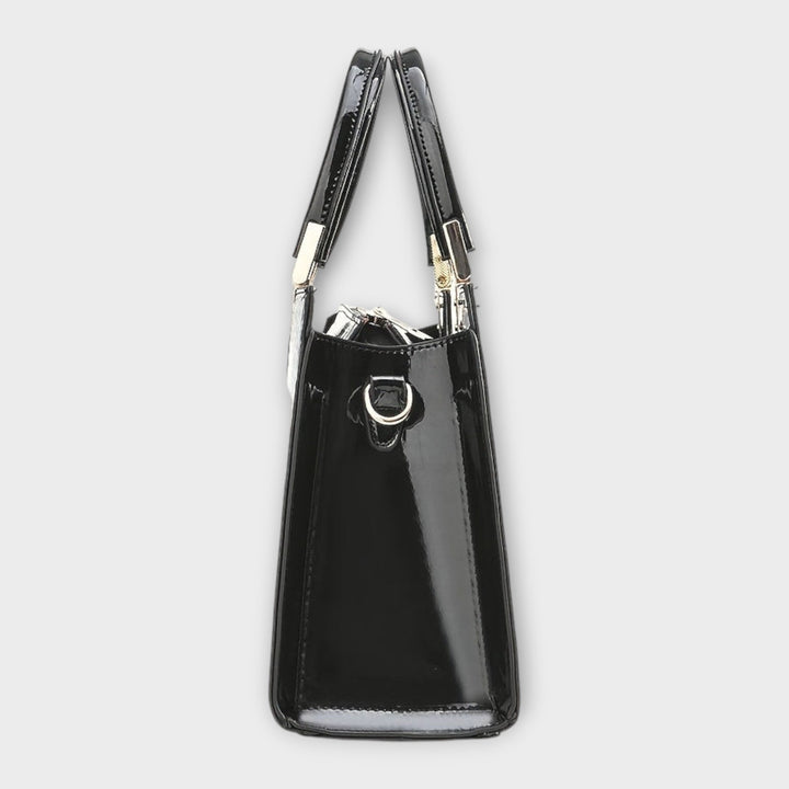 Solveig handbag in brown colorway displayed at a slight angle to show depth and shape