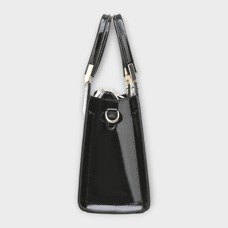Solveig handbag in brown colorway displayed at a slight angle to show depth and shape