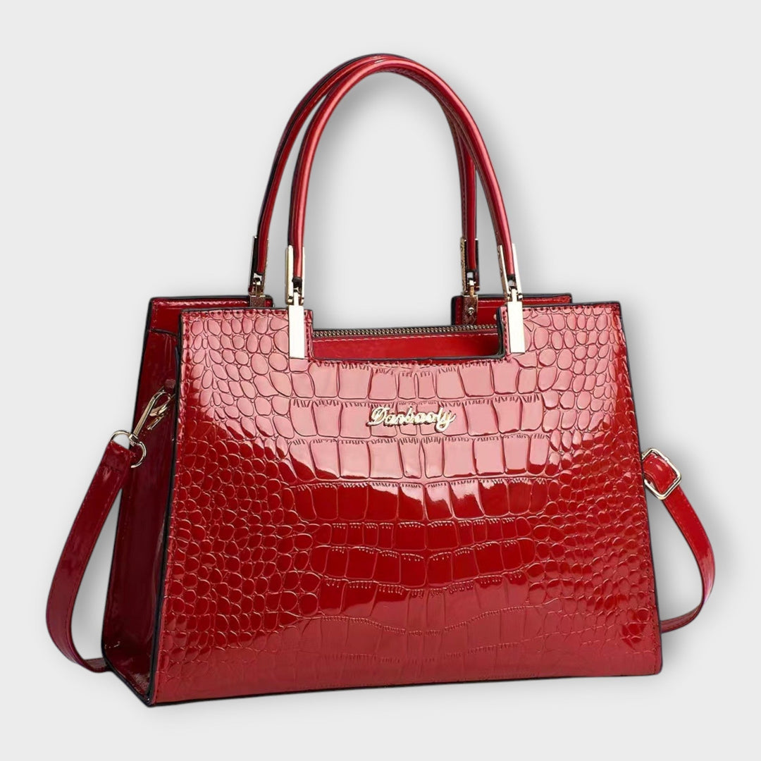 Interior or side view of the Solveig handbag showcasing spacious compartment and clean lining