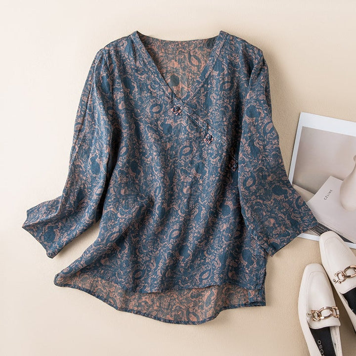 Woman wearing a relaxed embroidered button-front shirt in a soft flowing silhouette