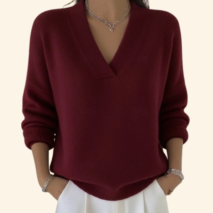 Woman wearing the Sonia relaxed V-neck sweater in a soft knit fabric, shown in a casual everyday outfit