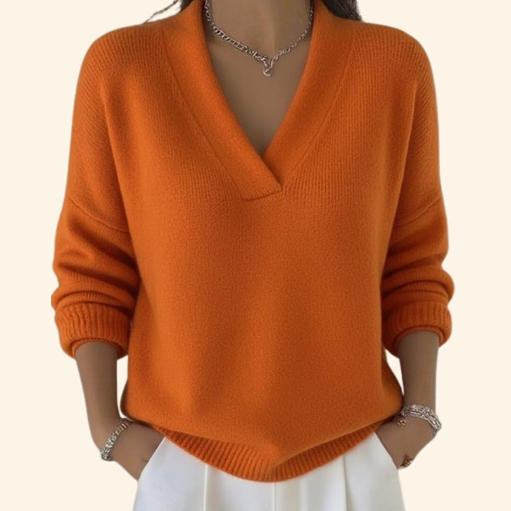 Sonia relaxed V-neck sweater displayed in multiple available colors including red, pink, green, black, and orange
