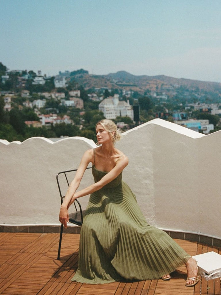 Detail shot of the sweetheart neckline on the olive green maxi dress