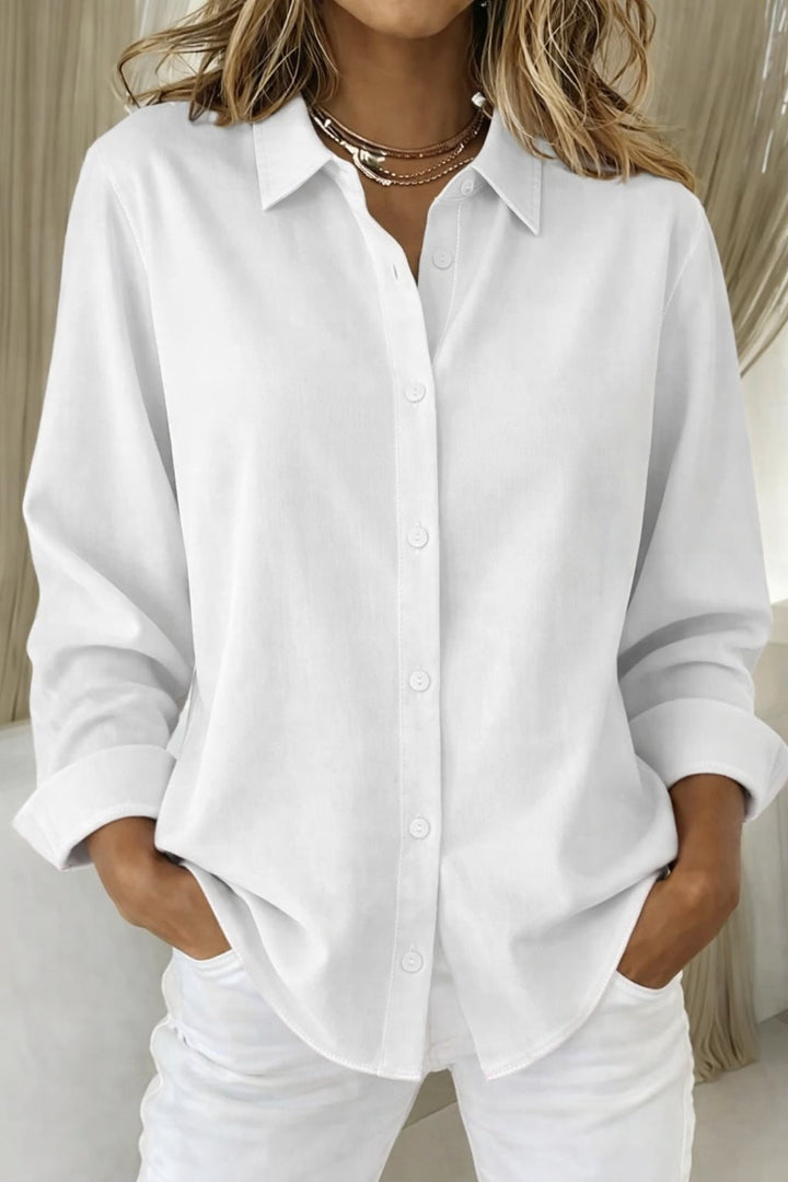 Side view of the Sophie button blouse showing sleeve length and overall length on model
