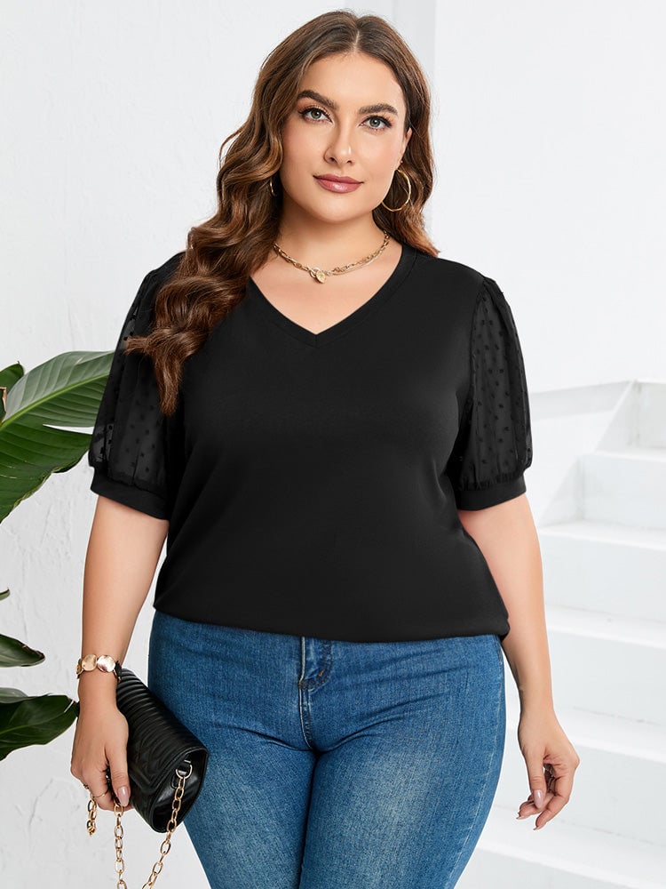 Model wearing the Sophora elegant V-neck top in white with a relaxed fit and delicate V-neckline