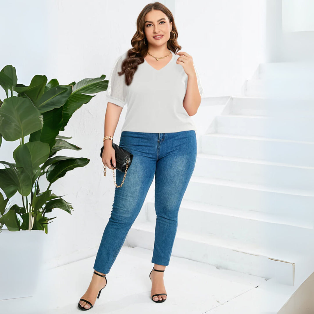 Front view of the Sophora V-neck top in black showcasing its lightweight, breathable fabric