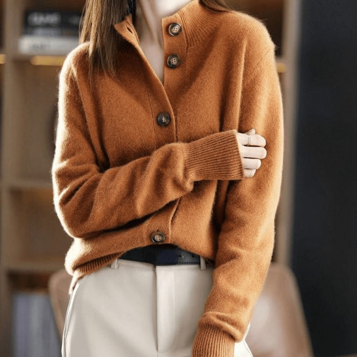 Model wearing an orange cashmere-style cardigan with a relaxed, flattering silhouette