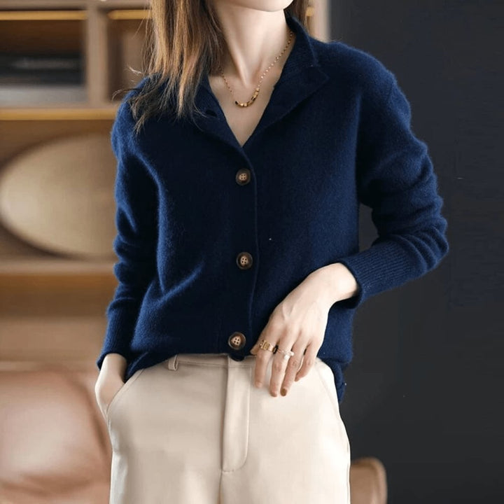Dark blue Stella cardigan displayed on a model highlighting the relaxed silhouette