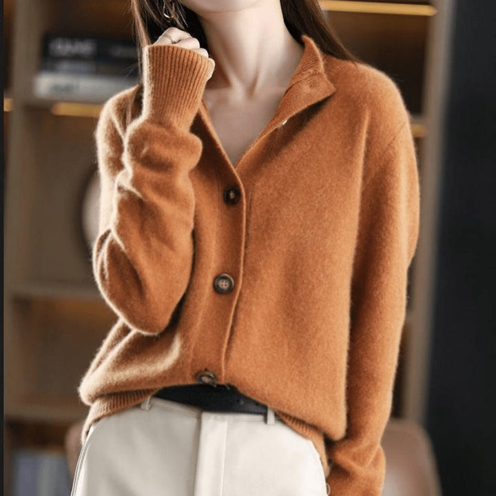 Close-up of the Stella cardigan neckline and button detailing in beige