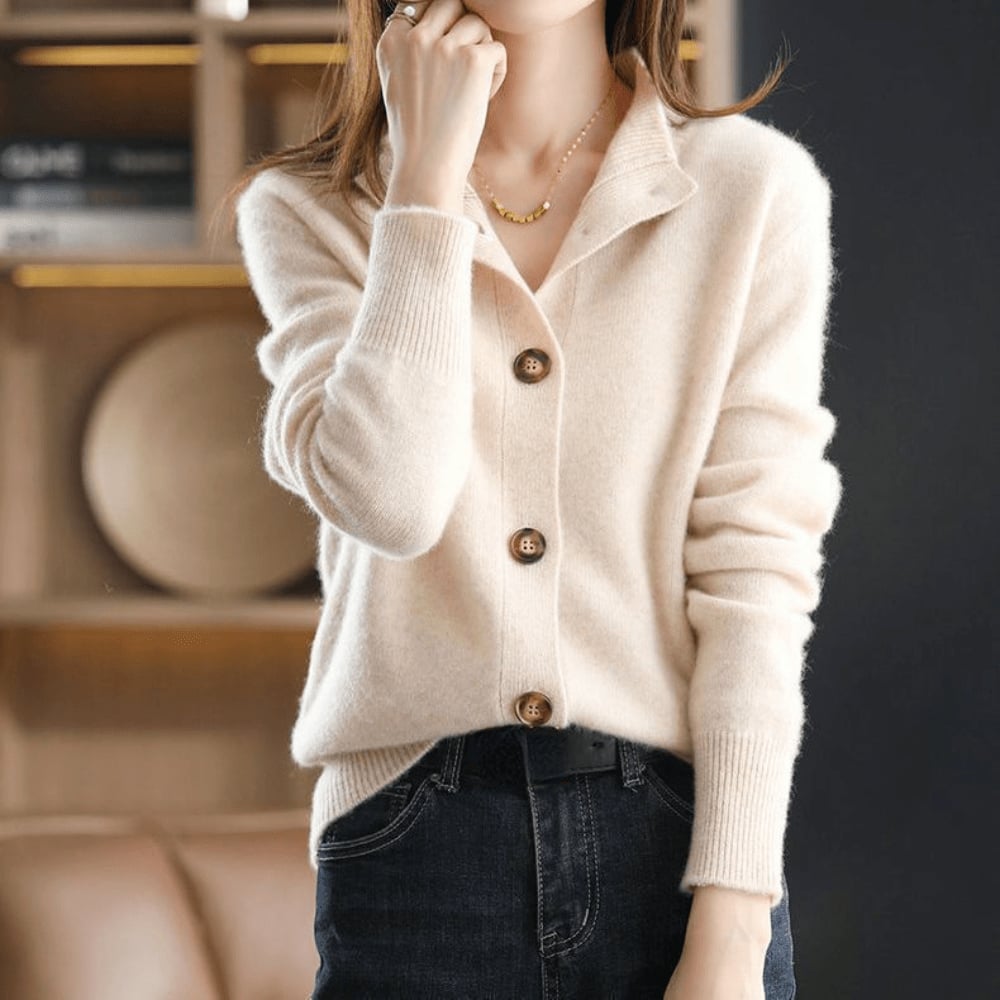 Model wearing the Stella cardigan dressed up with tailored trousers for a polished office look