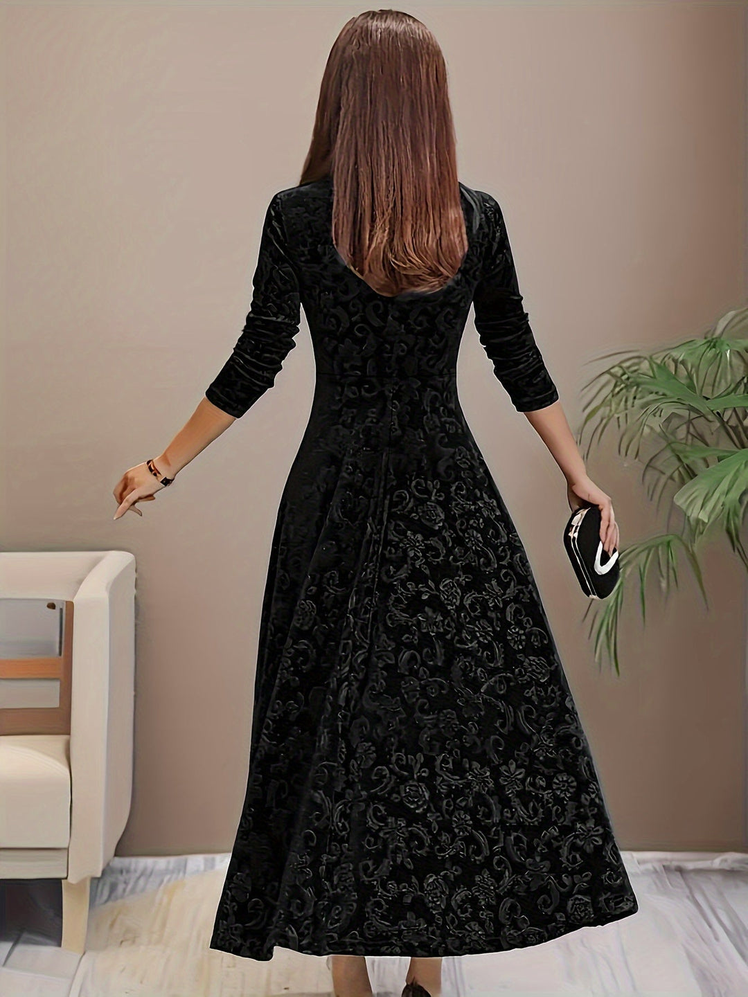 Full-length shot of model in the Stella elegant dress in black styled with heels for an evening look