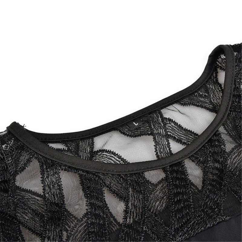 Back view of the Stella flowy midi dress in black, highlighting the clean elegant design