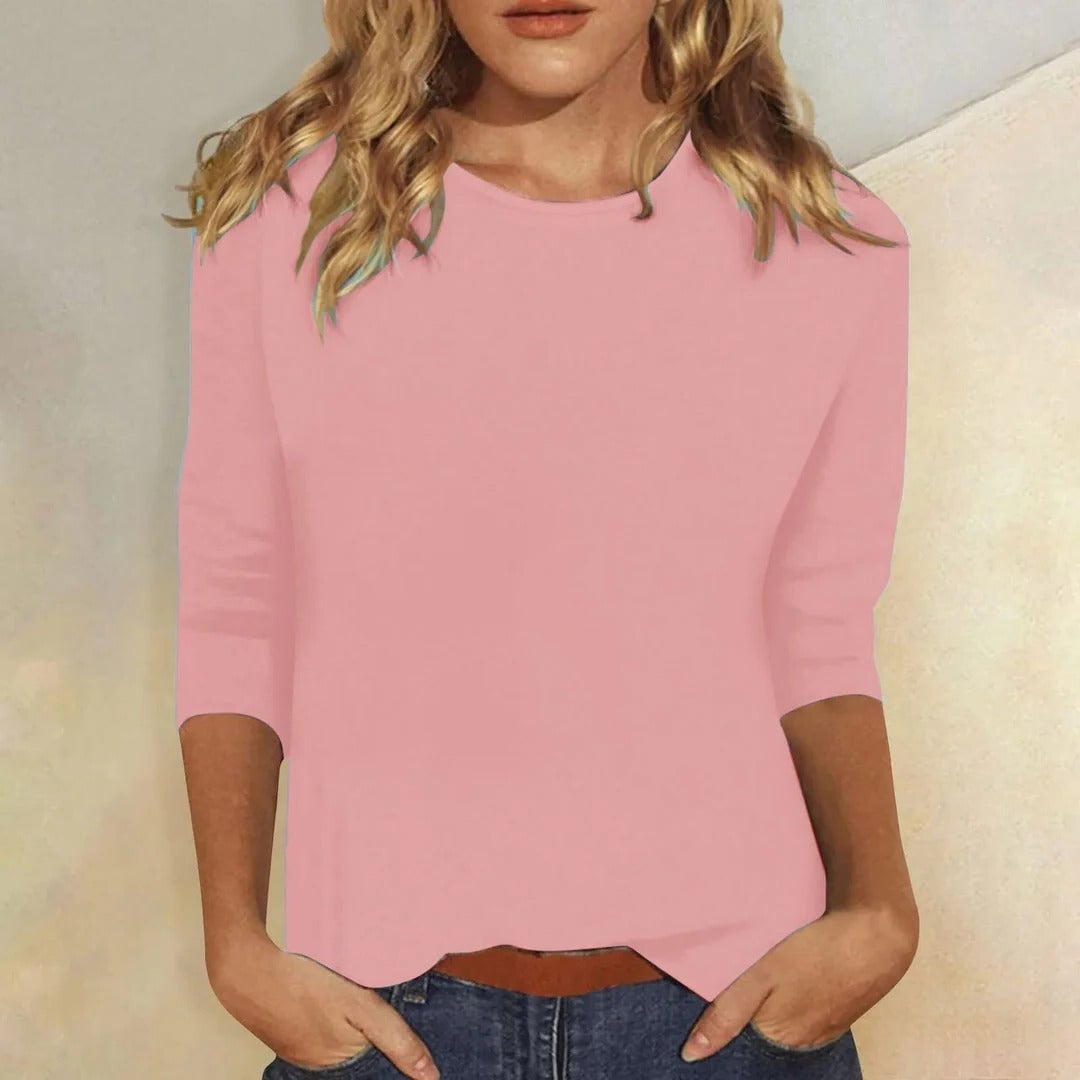 Woman wearing the Stella crew neck 3/4 sleeve top in pink with a relaxed regular fit