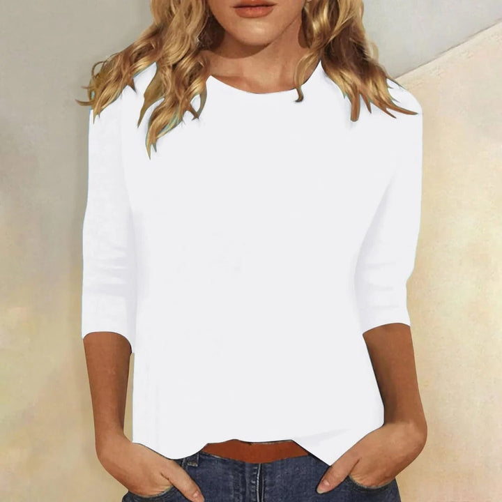 Front view of the Stella top in white showing the classic crew neckline