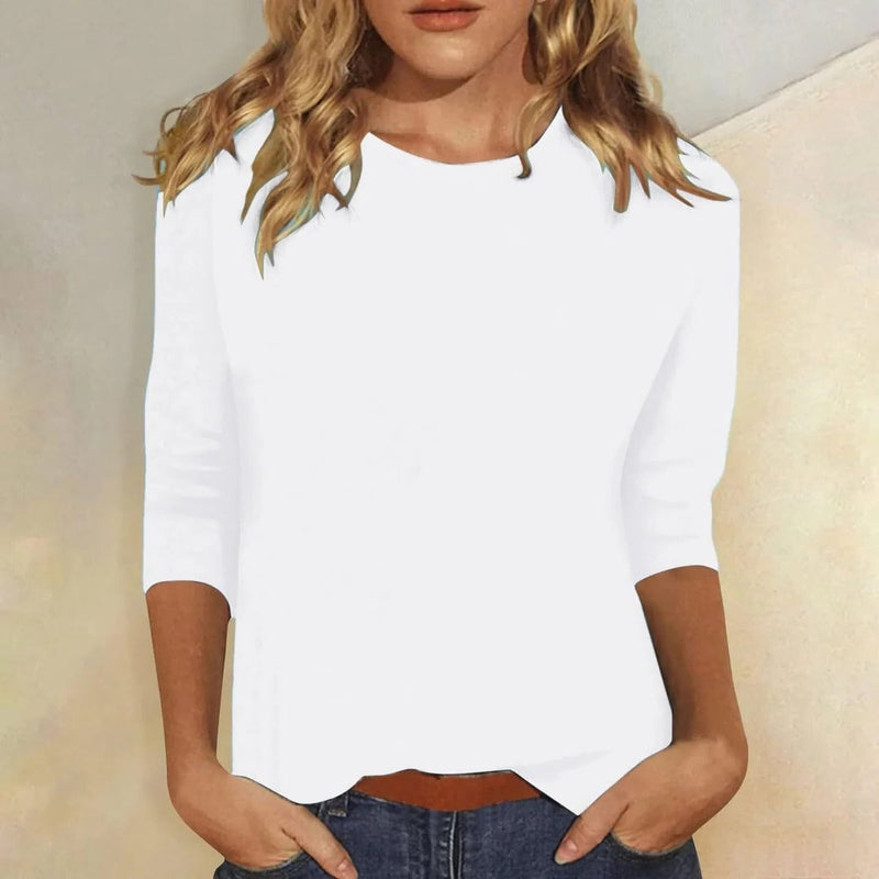 Front view of the Stella top in white showing the classic crew neckline