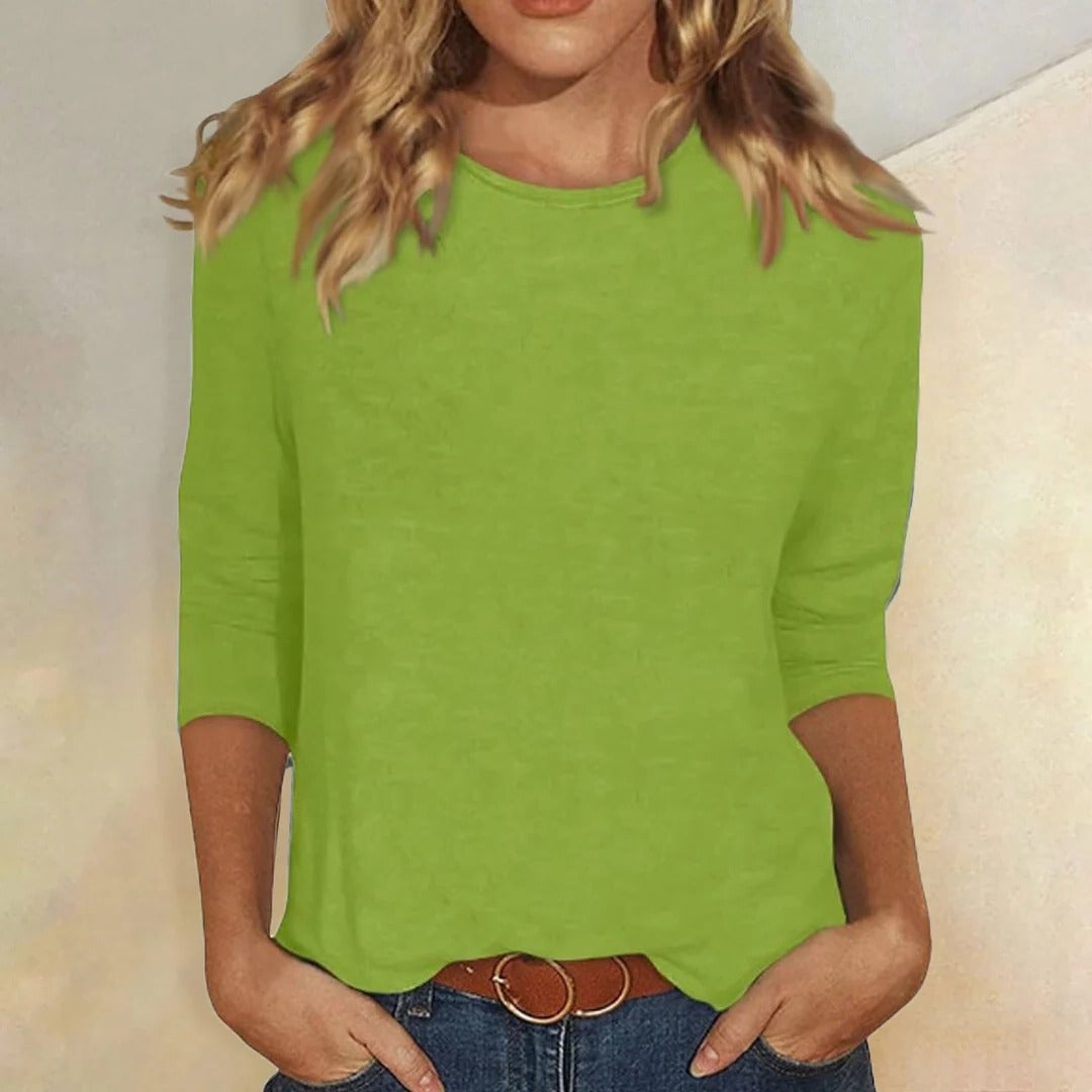 Stella crew neck top in green shown from the side to highlight the clean fit