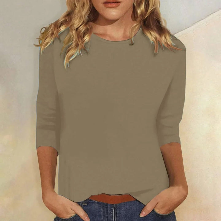 Stella top in khaki paired with tailored trousers for a polished casual look
