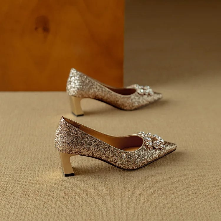 Stella gold glitter pumps worn on model showing leg-lengthening pointed toe silhouette