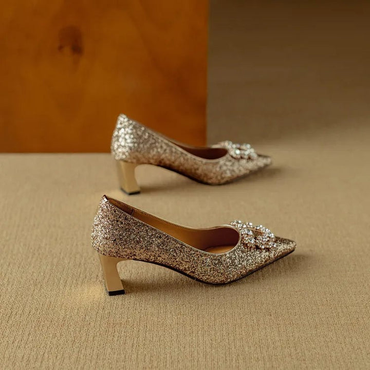 Stella gold glitter pumps worn on model showing leg-lengthening pointed toe silhouette