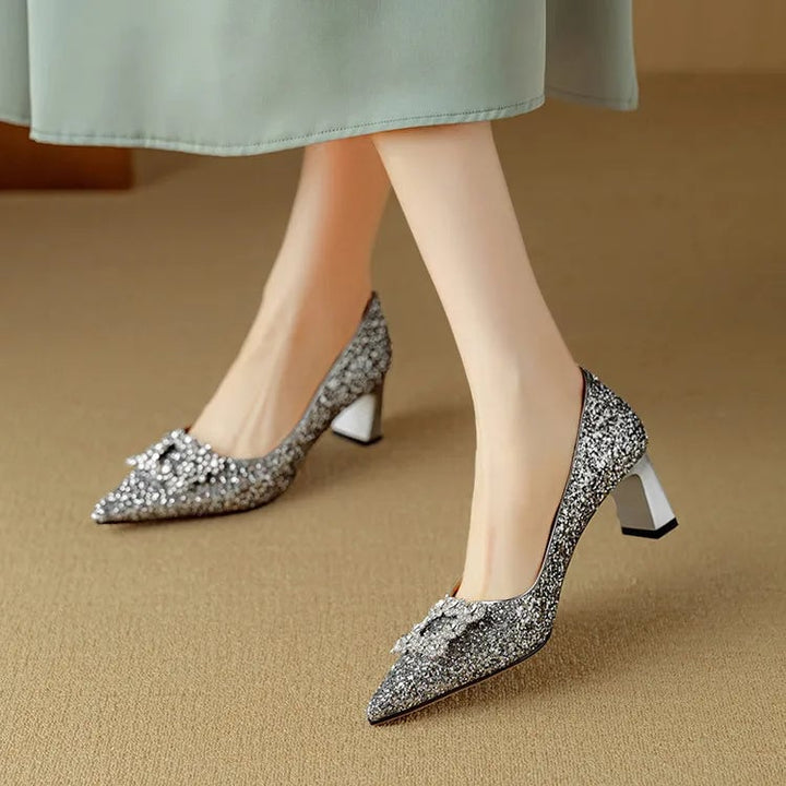 Stella gold glitter pumps styled with a cocktail dress on model