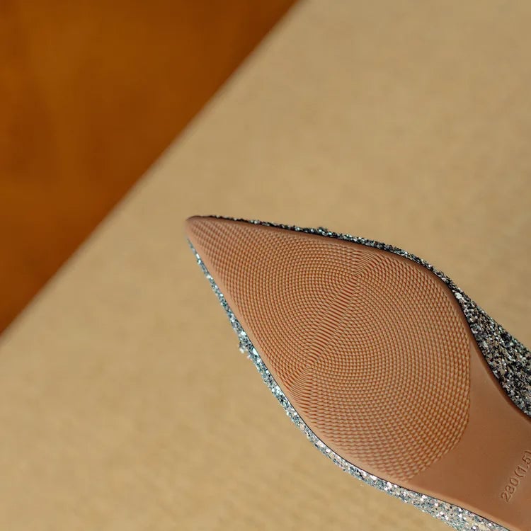 Stella silver glitter pump pointed toe close-up showing all-over shimmer finish
