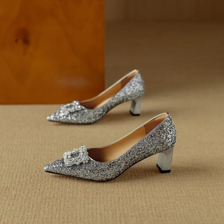 Stella silver glitter pumps worn on model showing leg-lengthening pointed toe silhouette