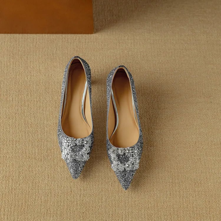 Stella silver glitter pumps styled with wide-leg trousers on model