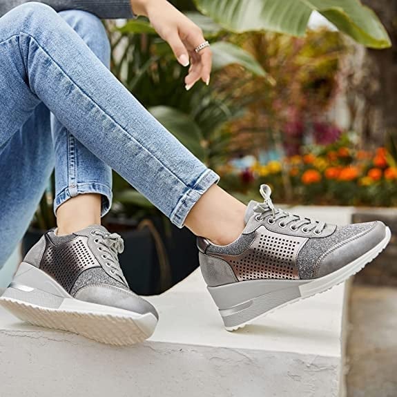Side profile of Stella hidden wedge sneaker in gray showing lace-up closure and platform wedge silhouette