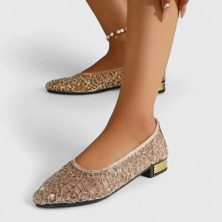 Close-up of delicate lace mesh upper and pointed toe on Stella flats in silver