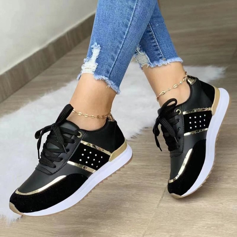 Top-down view of Stella lace-up sneakers highlighting dark laces and mixed-texture upper