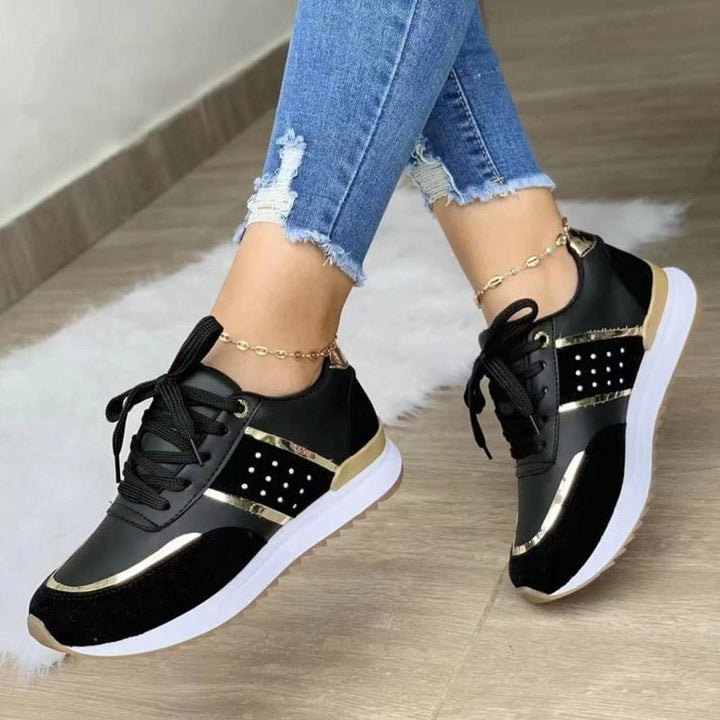 Top-down view of Stella lace-up sneakers highlighting dark laces and mixed-texture upper