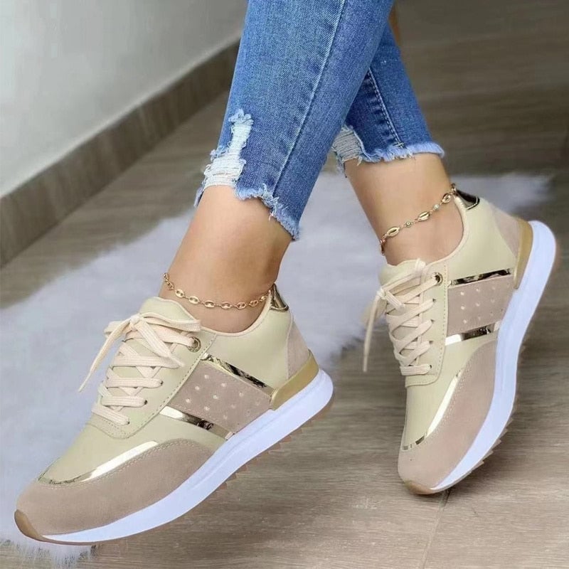 Stella fashion sneakers styled with casual denim outfit, showcasing gold side stripe detail