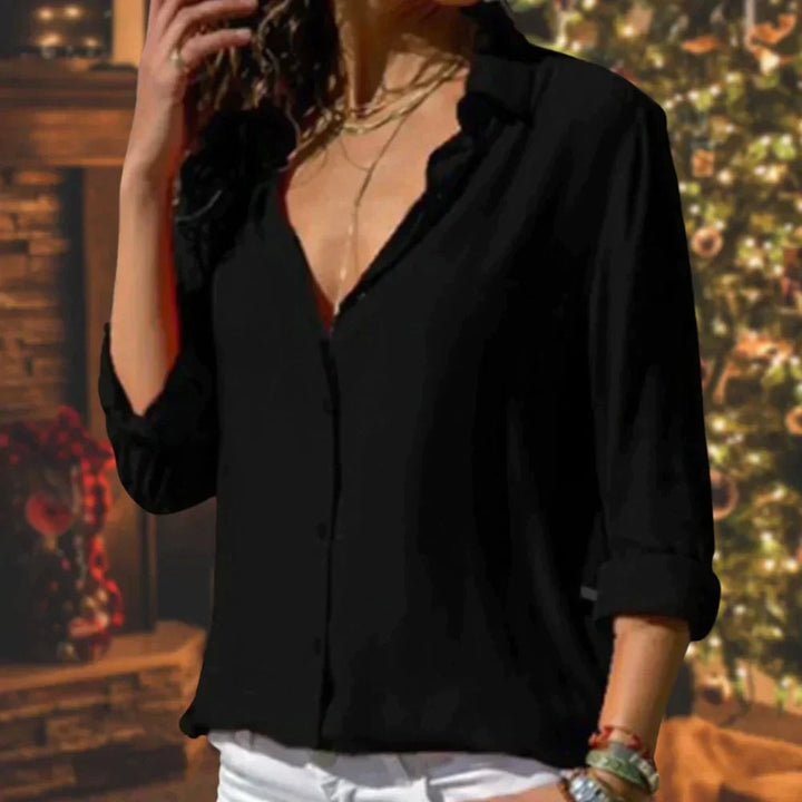 Back view of the Stella satin button-down blouse showing relaxed straight hem and long sleeves