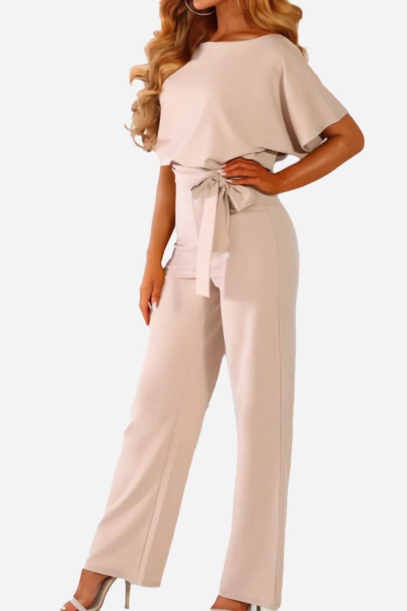 Front view of the Stella belted jumpsuit in black showing the wide-leg cut and round neckline