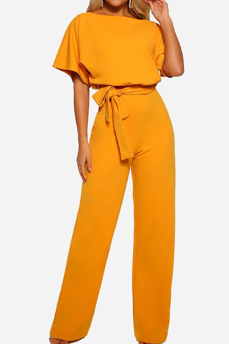 Side view of the Stella jumpsuit highlighting the cinched tie waist and flowing wide-leg pants