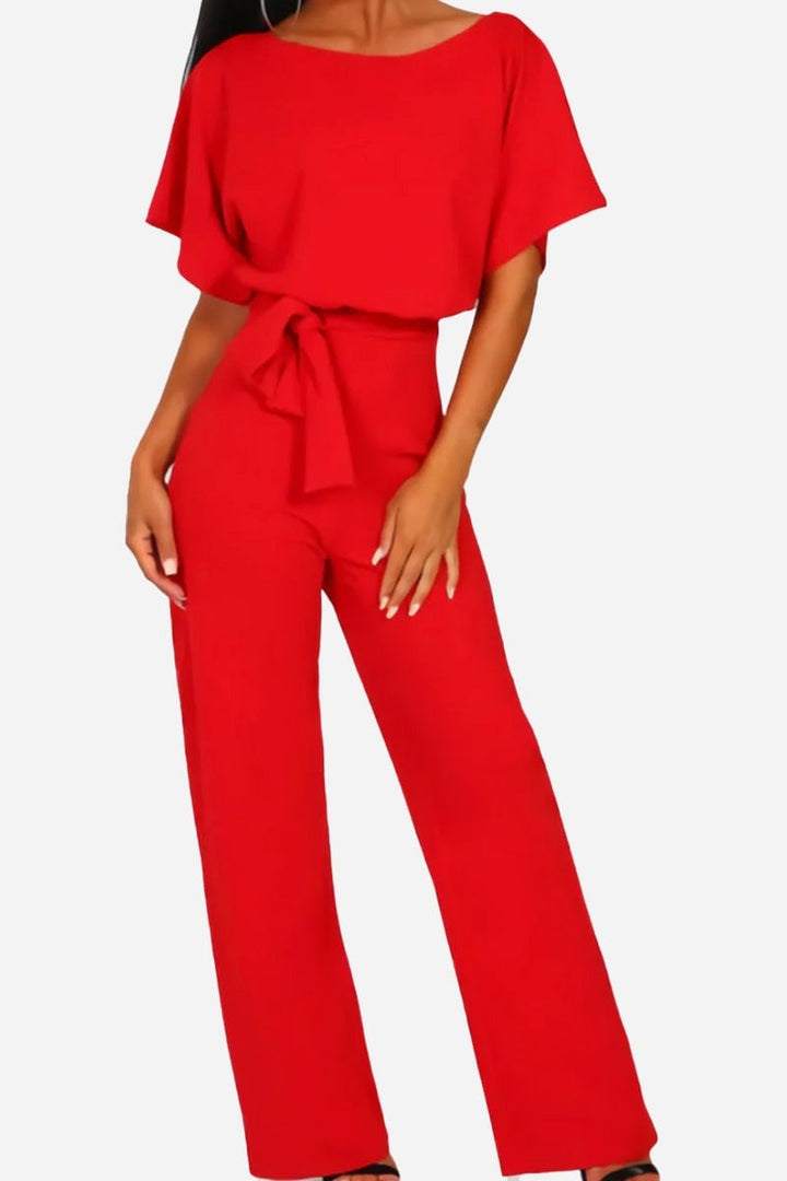 Back view of the Stella wide-leg jumpsuit in black showing the batwing sleeve detail