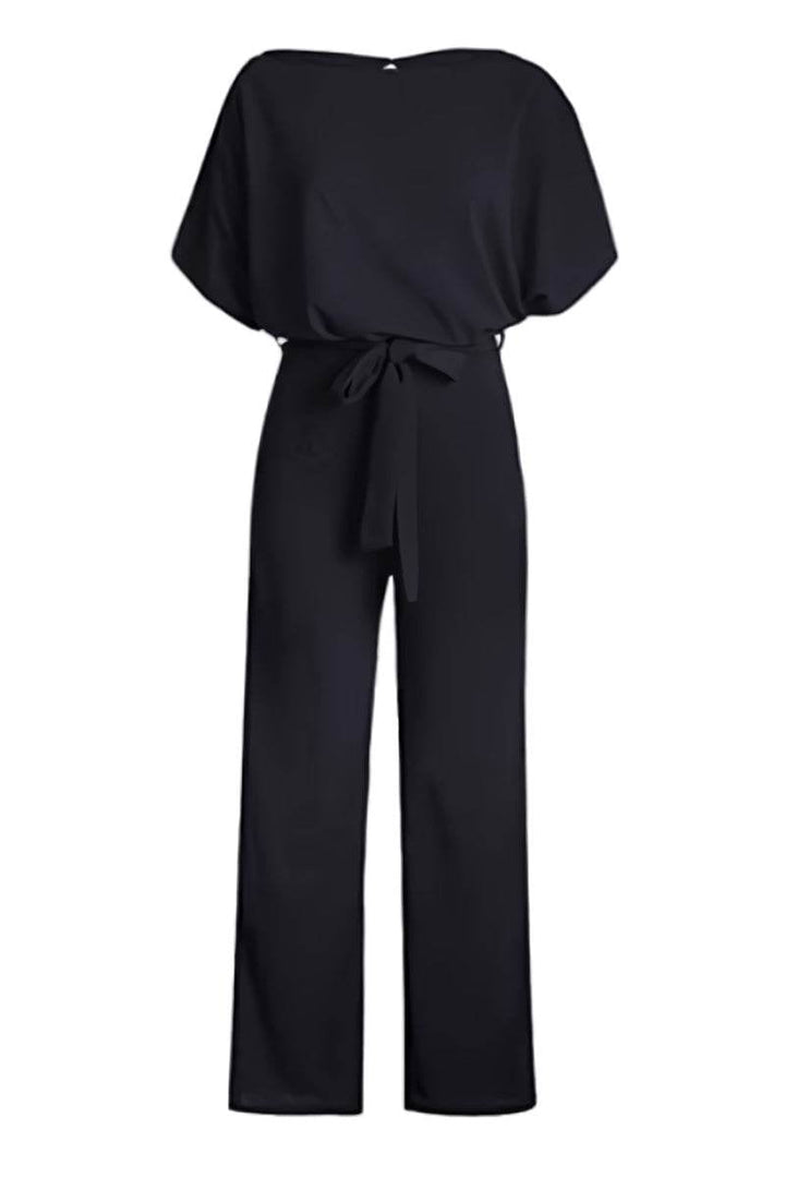 Close-up of the batwing sleeve and round neckline detail on the Stella jumpsuit in navy blue